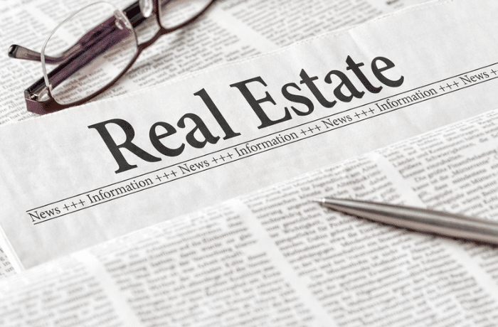 Newspaper Article with Real Estate as the headline